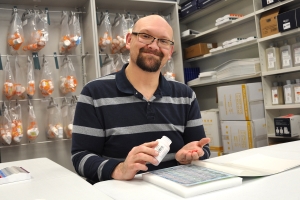 pharmacist handling medication 